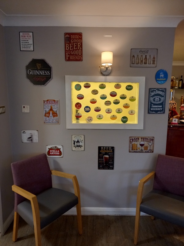Seating area decorated with beer and drink signs