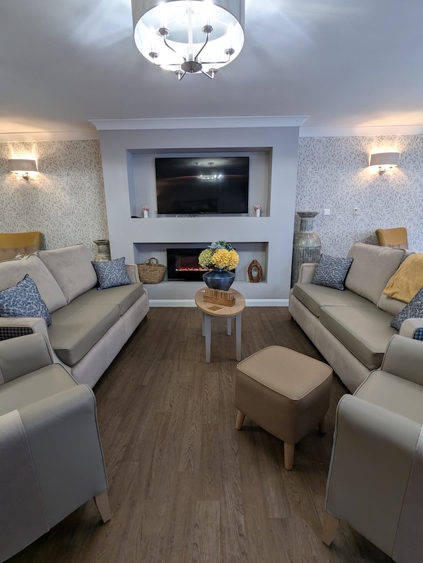 Victoria Mews lounge with TV and four couches